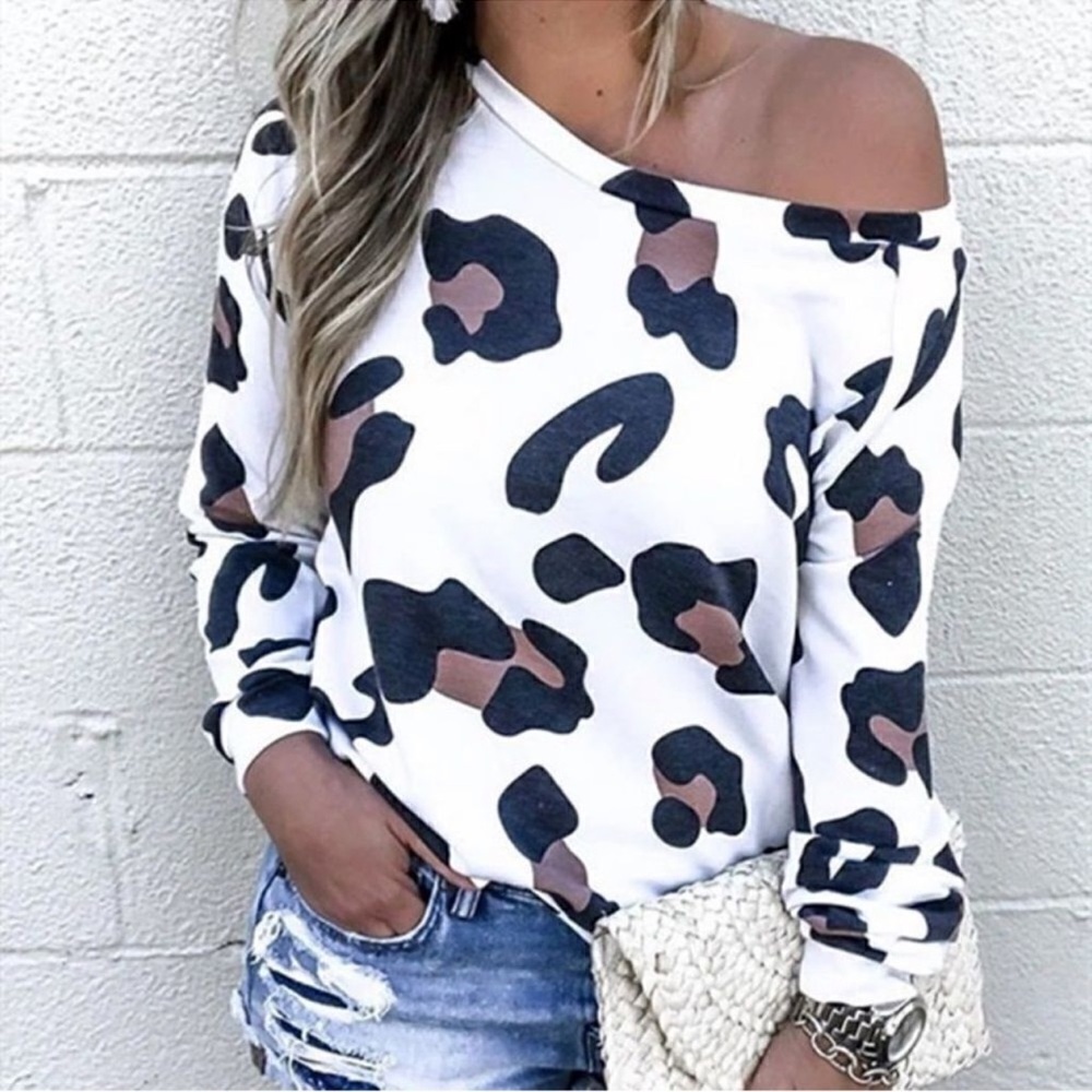 Light weight white animal print long sleeve shirt. Purple and black accents